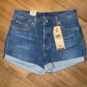 Levi denim mid rise jean shorts.
